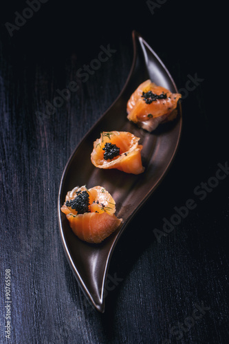 salmon rolls with black caviar