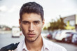 Attractive young man's headshot in urban environment Attractive young man's headshot in urban environment