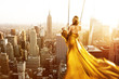 Woman on a swing above New York City Woman on a swing above New York City