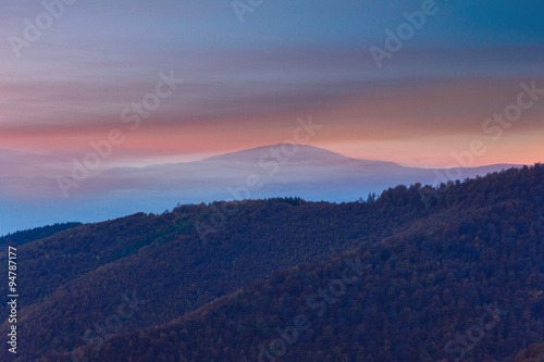 Colorful sunset  in the autumn mountains.