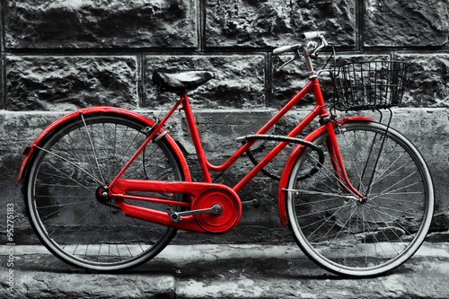  Retro vintage red bike on black and white wall.