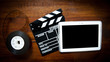 Screenwriter desktop with movie symbols Screenwriter desktop with movie symbols