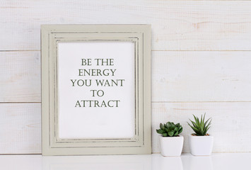 Motivation words Be the energy you want to attract, inspiration quote. Shabby chic, vintage style. Scandinavian style home interior decoration.