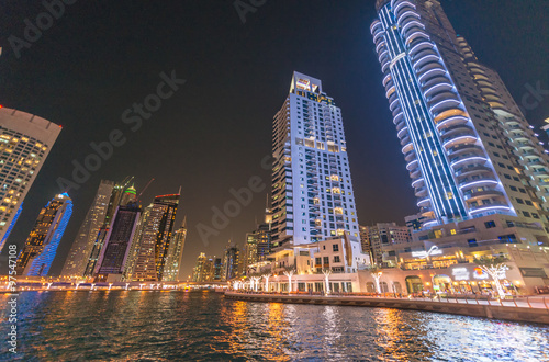 Street view of Dubai Marina skyscrapers at night