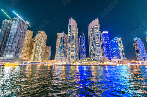 Street view of Dubai Marina skyscrapers at night