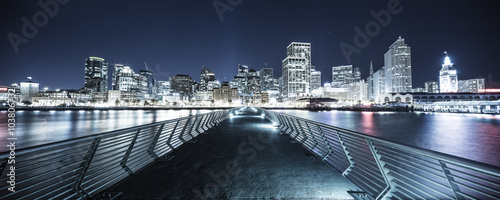 Fototapeta footpath over water at night in San Francisco