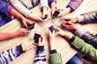 Top view hands circle using phone in cafe - Multiracial friends mobile addicted interior scene from above - Wifi Connected people in bar table meeting - Concept of teamwork Top view hands circle using phone in cafe - Multiracial friends mobile addicted interior scene from above - Wifi Connected people in bar table meeting - Concept of teamwork