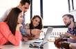 Group of young business people and designers.They working on new project. Group of young business people and designers.They working on new project.