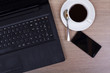 Lay flat image of a laptop and coffee cup Lay flat image of a laptop and coffee cup