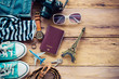 Accessories and apparel for travel on a wooden floor - life style Accessories and apparel for travel on a wooden floor - life style
