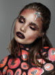 Fashion model with art make up orange and black color Fashion model with art make up orange and black color