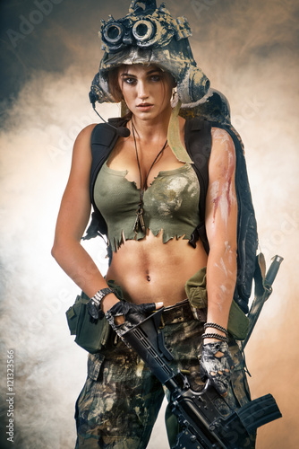 Girl with a gun and unusual camouflage