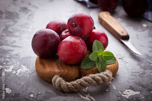 Sweet plums on wooden background
