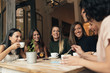 Six beautiful women drinking coffee and chatting. Six beautiful women drinking coffee and chatting.