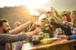 Happy friends having fun outdoors - Young people enjoying harvest time together at farmhouse vineyard countryside - Youth and friendship concept - Focus on hands toasting wine glasses with sun flare Happy friends having fun outdoors - Young people enjoying harvest time together at farmhouse vineyard countryside - Youth and friendship concept - Focus on hands toasting wine glasses with sun flare