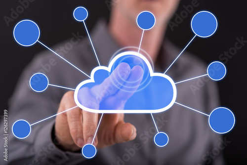Man touching a cloud networking on a touch screen