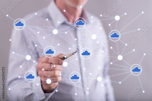 Man touching a cloud networking on a touch screen