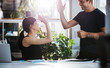 Successful business colleagues giving high five Successful business colleagues giving high five