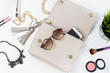 Fashion woman handbag with cellphone, makeup and accessories Fashion woman handbag with cellphone, makeup and accessories