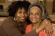 Portrait of a senior woman hugging her daughter. Portrait of a senior woman hugging her daughter.