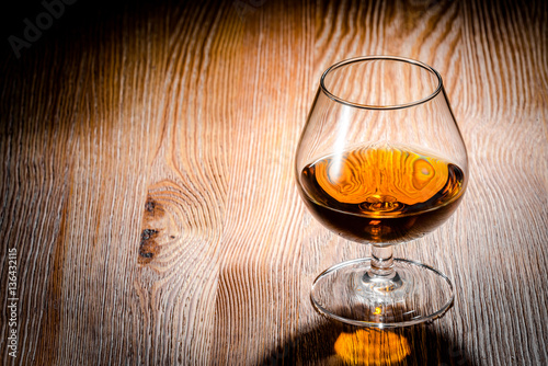 Whiskey or brandy on a wooden table