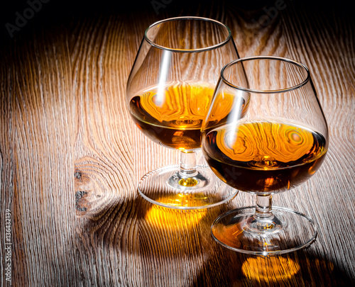 Whiskey or brandy on a wooden table