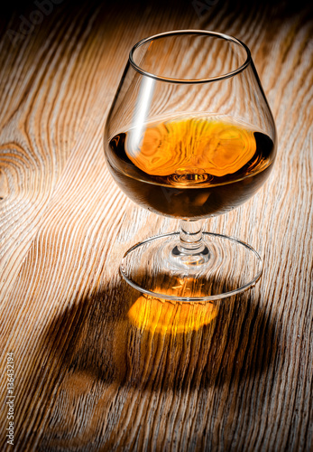Whiskey or brandy on a wooden table