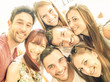 Happy best friends taking selfie outdoors with spring time backlighting - Friendship and happiness concept with young people having fun together - Warm vintage filter with bright sunshine color tones Happy best friends taking selfie outdoors with spring time backlighting - Friendship and happiness concept with young people having fun together - Warm vintage filter with bright sunshine color tones