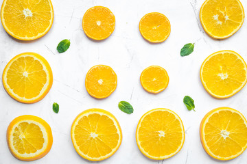 Orange slices with mint on white background top view pattern