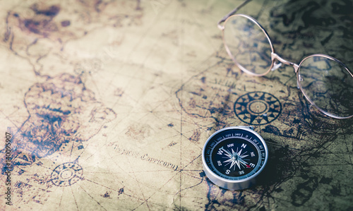 Obraz Fotograficzny Vintage world Explorer equipment with compass on vintage map