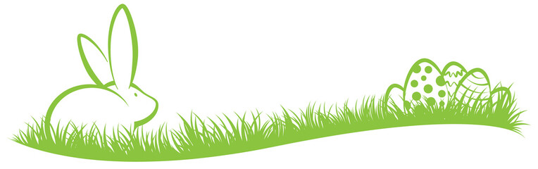 Osterhase und Ostereier auf grünem Gras