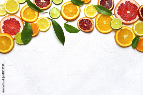 Food background withs slices of variety citrus .Top view with copy space.