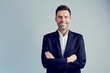 Happy businessman isolated - handsome man standing with crossed arms Happy businessman isolated - handsome man standing with crossed arms