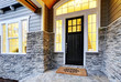 Front covered porch design with stone columns Front covered porch design with stone columns