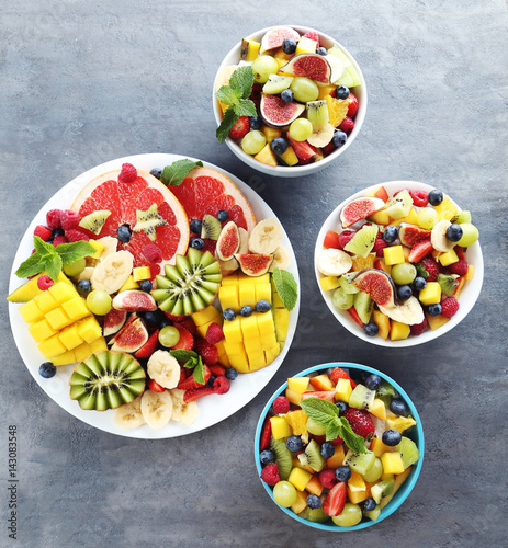 Fresh fruit salad on a grey wooden table