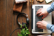 Wooden desktop with laptop, books and headphones Wooden desktop with laptop, books and headphones