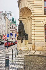Street with St Nicholas Church in Old Town in Prague