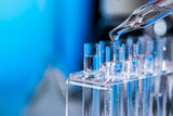 Science laboratory research and development concept. microscope with test tubes