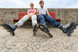 Young people friends relaxing on bench. Young people friends relaxing on bench.