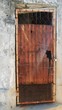 Locked old door An old door with screen, rusty galvanized tin and padlock Locked old door An old door with screen, rusty galvanized tin and padlock