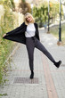 Beautiful young blonde woman in urban background Beautiful young blonde woman in urban background