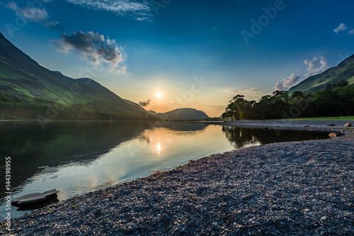 Stunning sunset at lake in District Lake in summer, England
