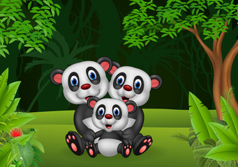 Cartoon panda family in the jungle