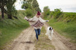 Young woman run with dog outdoor Young woman run with dog outdoor