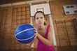 High school girl playing basketball in the court High school girl playing basketball in the court