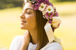Young woman with flowers in her hair on sunny spring day Young woman with flowers in her hair on sunny spring day