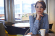 Beautiful brunette using laptop in cafe. Blogger work concept Beautiful brunette using laptop in cafe. Blogger work concept