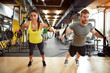 Couple on body training in gym Couple on body training in gym