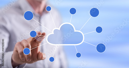 Man touching a cloud networking on a touch screen