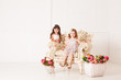 Two girls sits in a magnificent ancient armchair Two girls sits in a magnificent ancient armchair